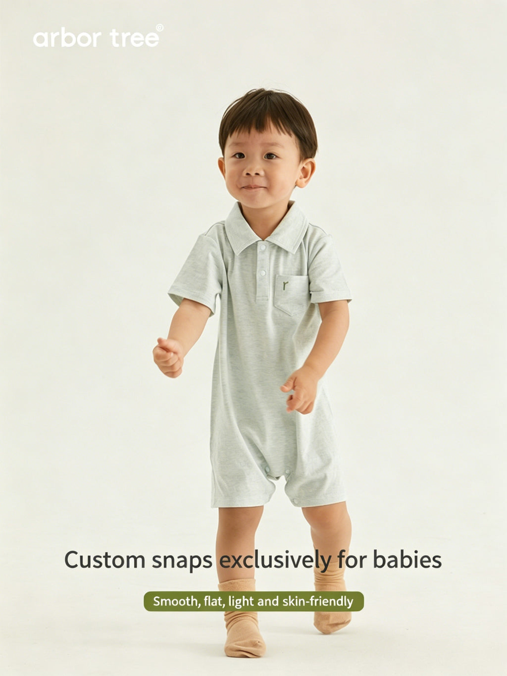 Organic cotton baby polo neck bodysuit by ArborTree, featuring a soft, natural fabric and classic design for infants.