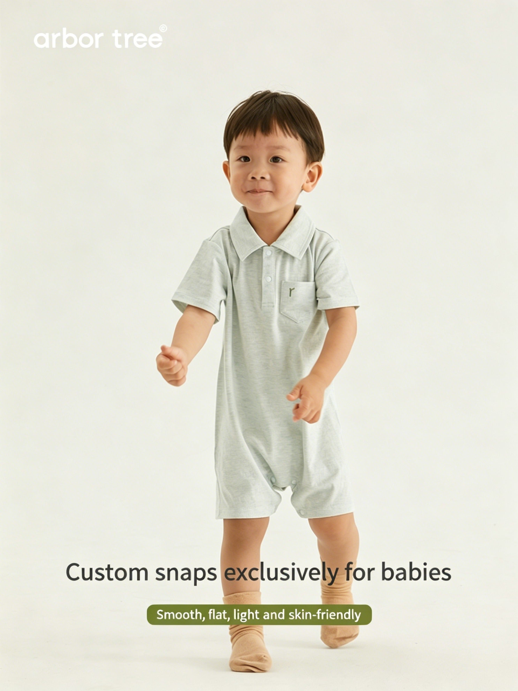 Organic cotton baby polo neck bodysuit by ArborTree, featuring a soft, natural fabric and classic design for infants.