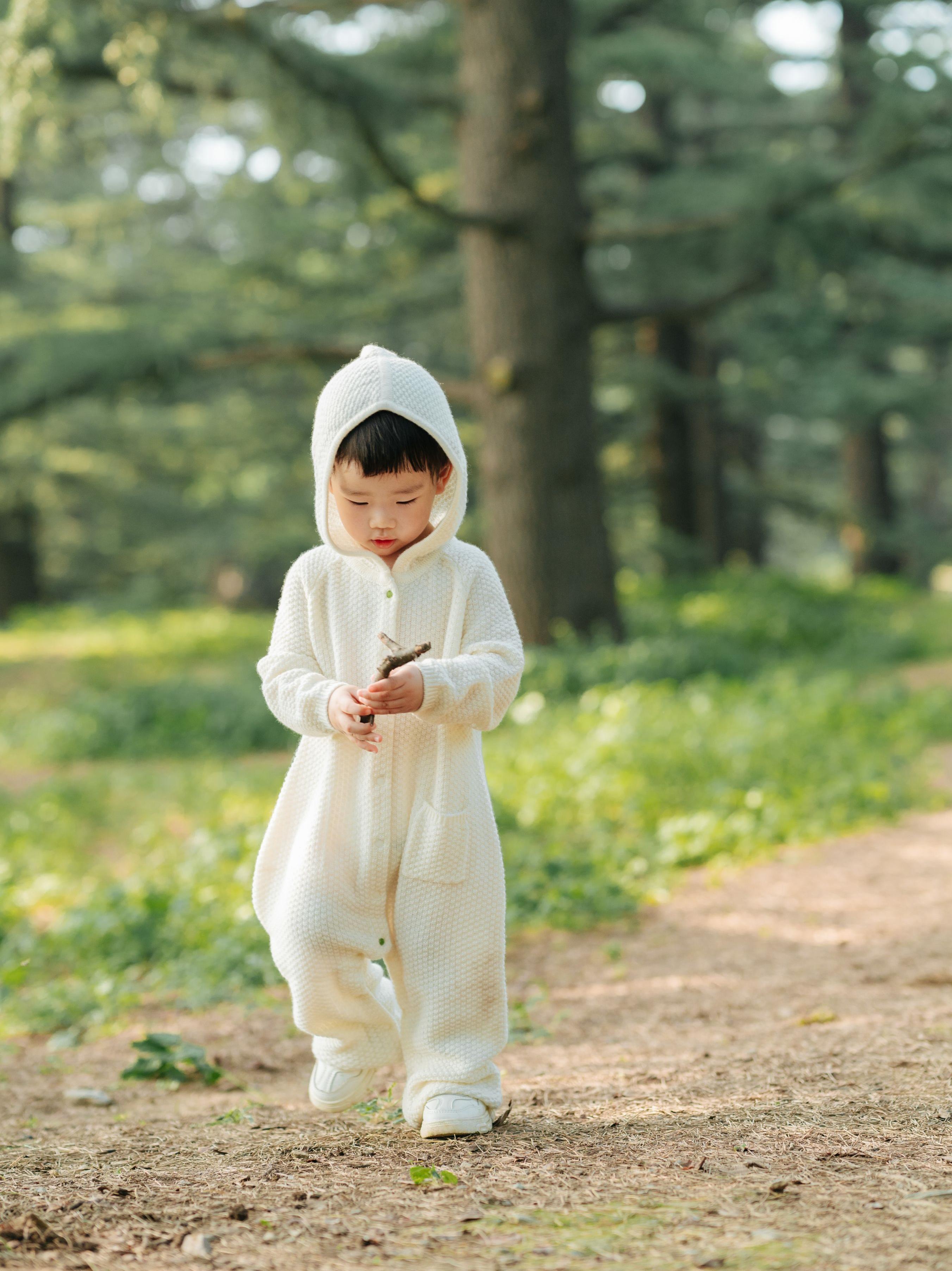 ArborTree 100% cashmere hooded onesie for kids, soft and cozy with a hood, made from naturally sourced cashmere fabric.