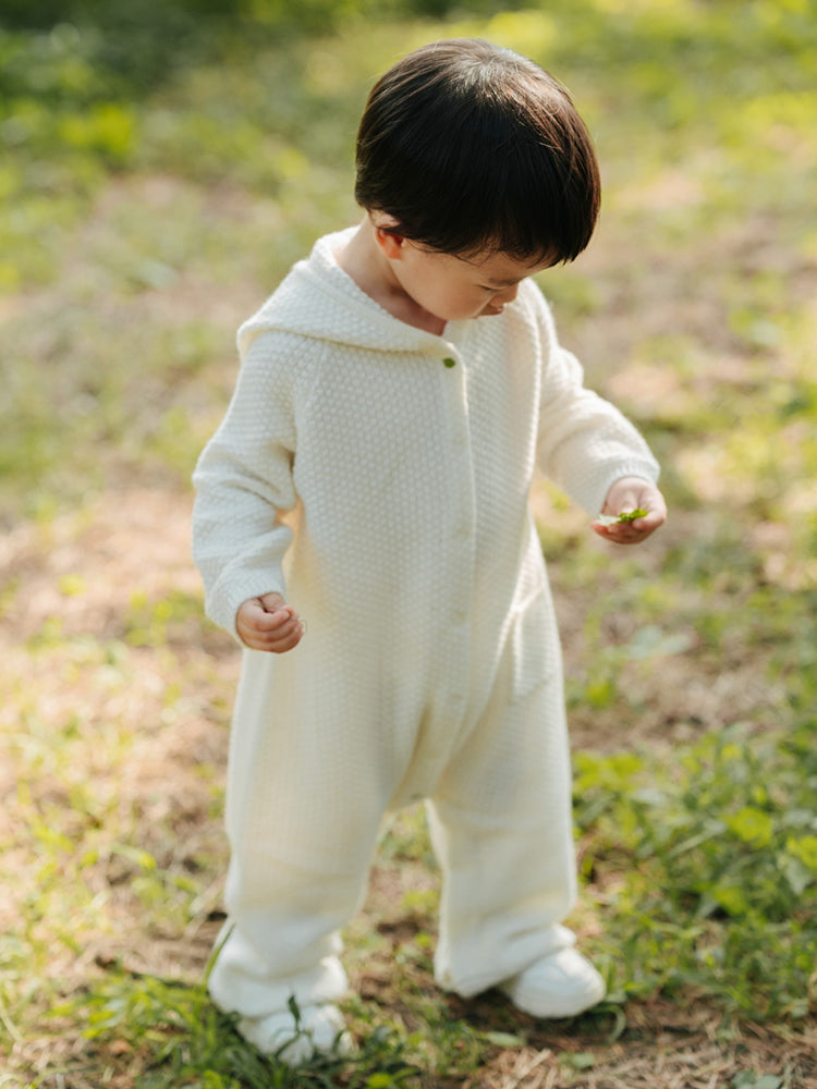 ArborTree 100% cashmere hooded onesie for kids, soft and cozy with a hood, in a natural color, ideal for warm winter wear.
