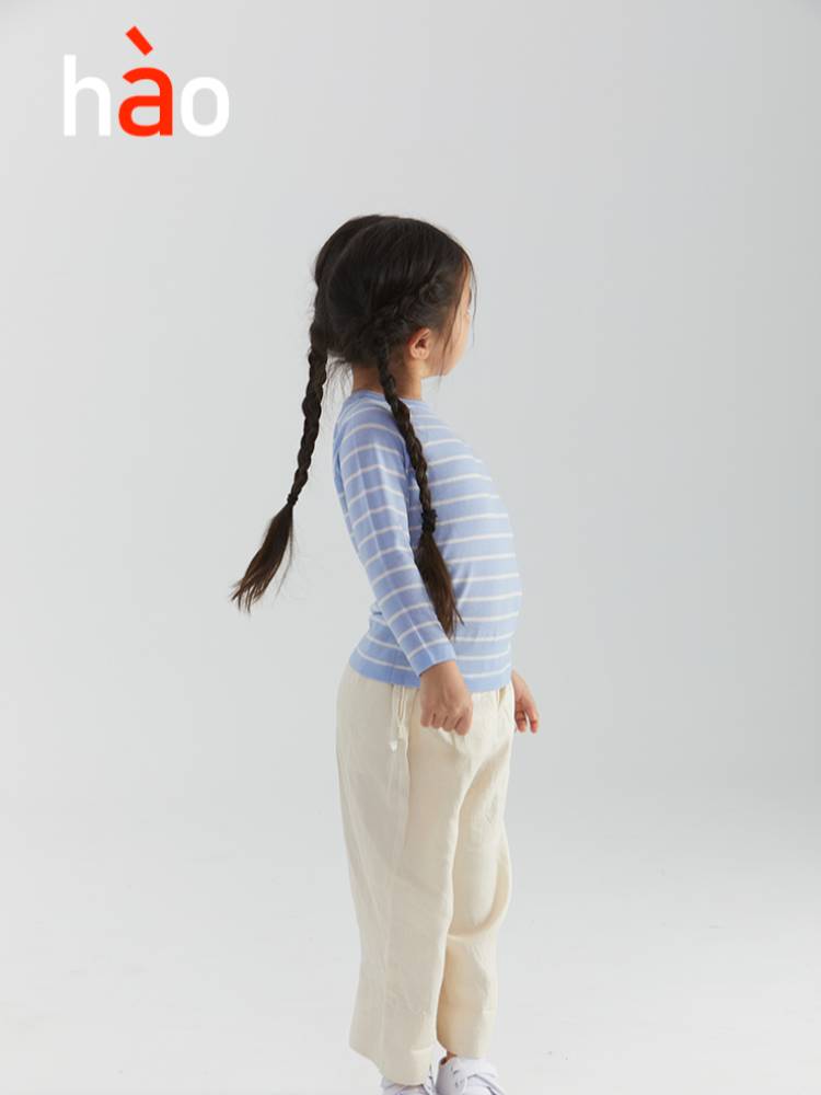 Baby striped pullover top made of 100% merino mercerized wool by ArborTree, showcasing soft, colorful knitwear for infants.