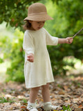 Soft ArborTree baby dress made from 100% Merino superfine wool, featuring a cozy, natural woolen fabric for newborns and infants.