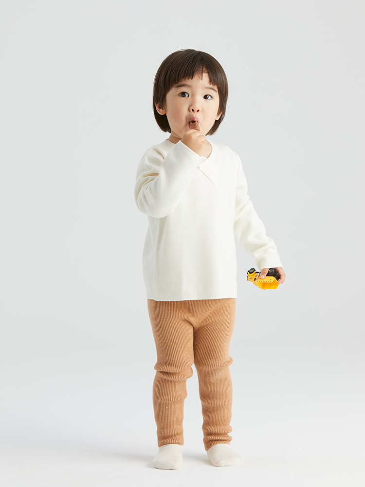 ArborTree baby pullover sweater made of 100% Baselwool, featuring a button-down front and soft, natural wool knit.