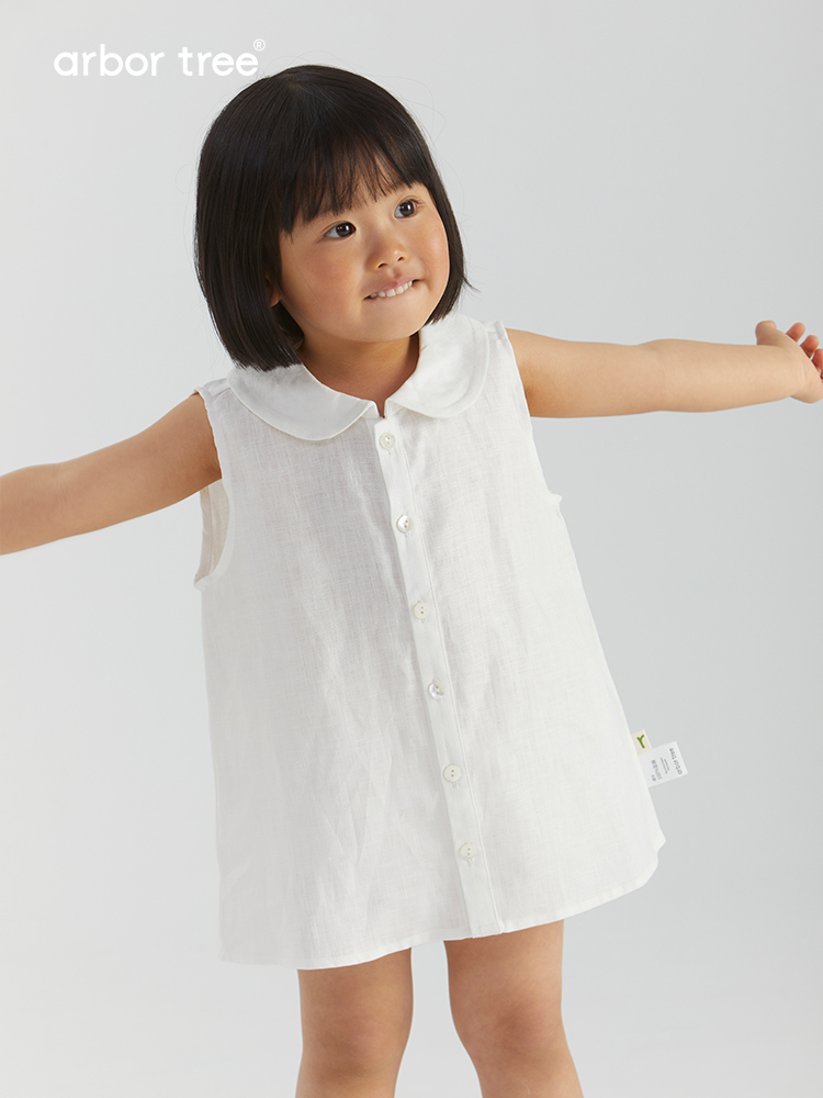 ArborTree girl's linen A-line skirt with front opening, natural fabric, 14x14 thread count, shown in soft beige color.