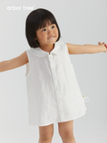 ArborTree girl's linen A-line skirt with front opening, natural fabric, 14x14 thread count, shown in soft beige color.