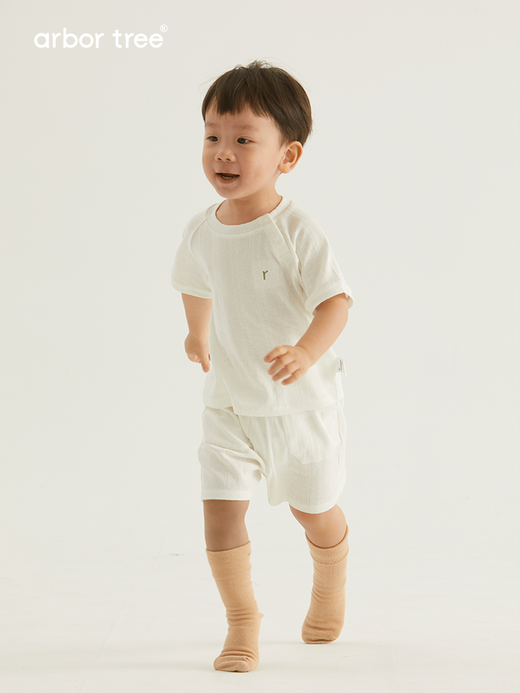Organic cotton baby summer suit by ArborTree, natural and breathable baby clothing for warm weather, shown in the image.