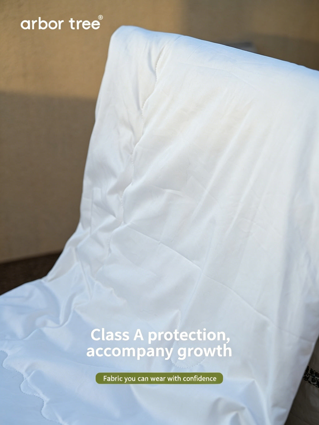 ArborTree organic cotton satin and silk baby quilt with natural materials, soft and skin-friendly for children.
