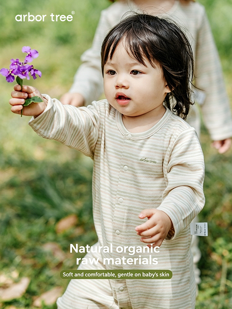 Colorful ArborTree organic cotton baby bodysuit with playful designs, made from 100% natural, breathable organic cotton for babies.