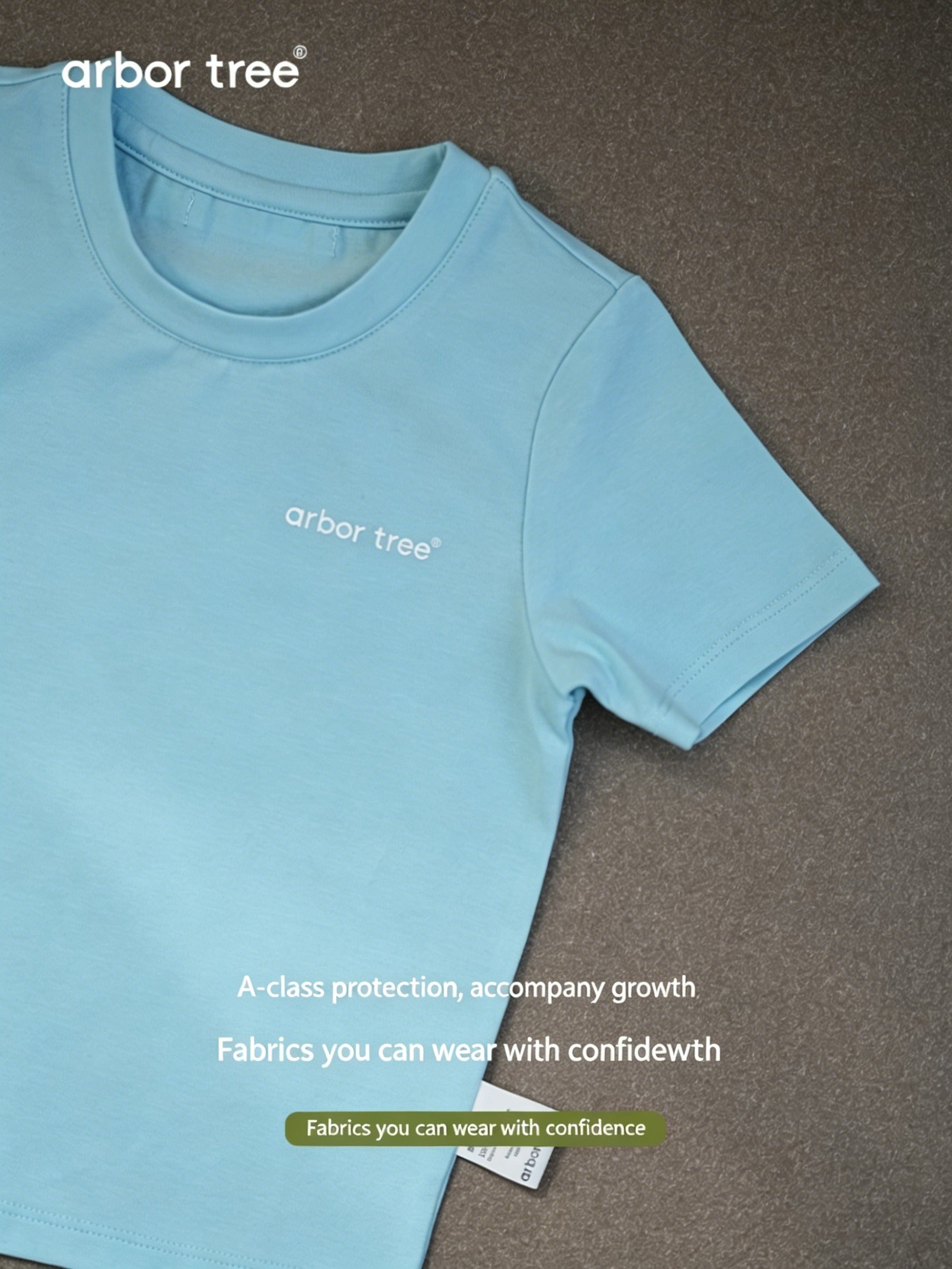 Lightweight, breathable organic cotton parent-child summer T-shirts by arbortree, shown in a casual outdoor setting.