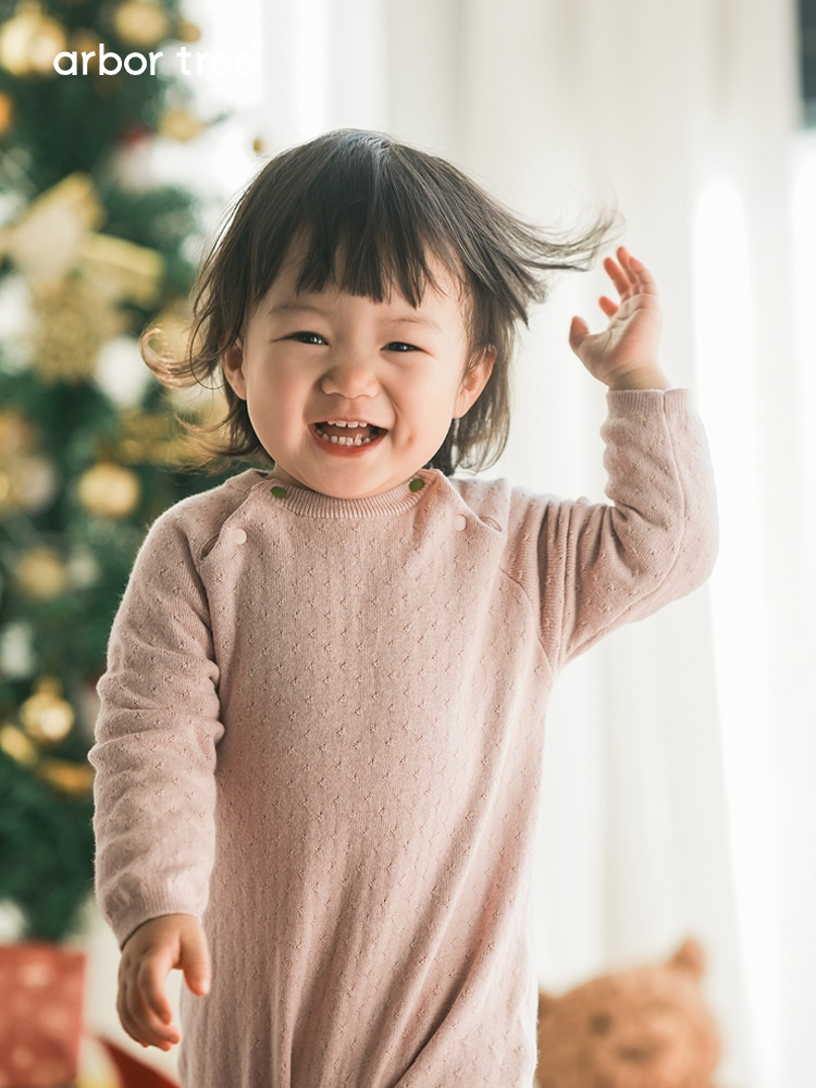 Organic cotton cashmere infant romper by arbortree featuring long sleeves, shoulder splits, and thick-knit cozy design.