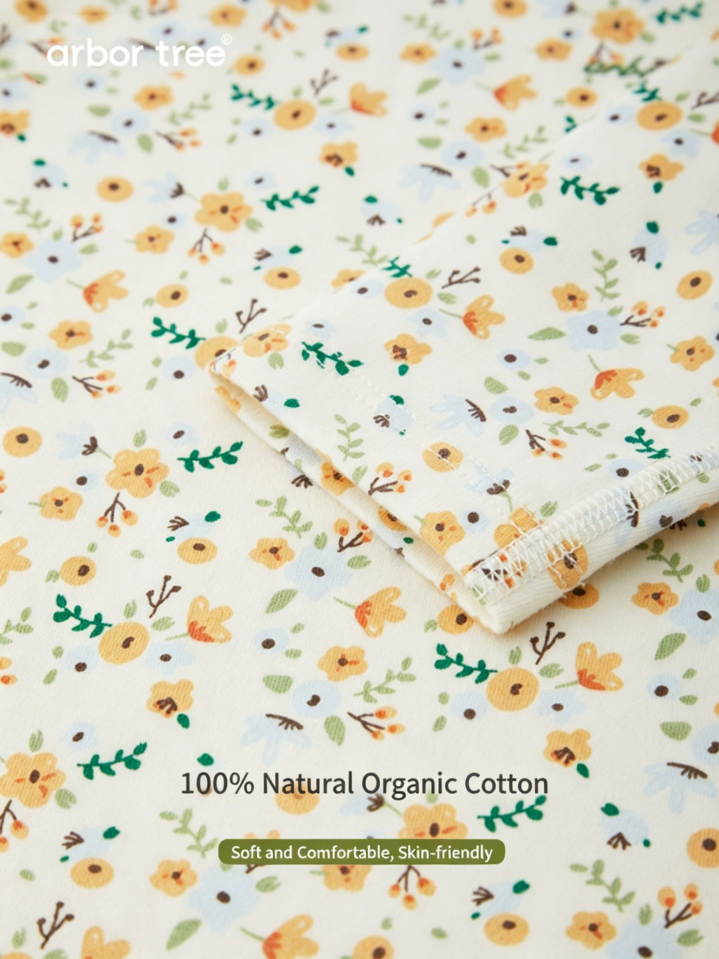 ArborTree organic cotton baby romper with small floral print, long sleeves, soft and gentle on baby's skin.