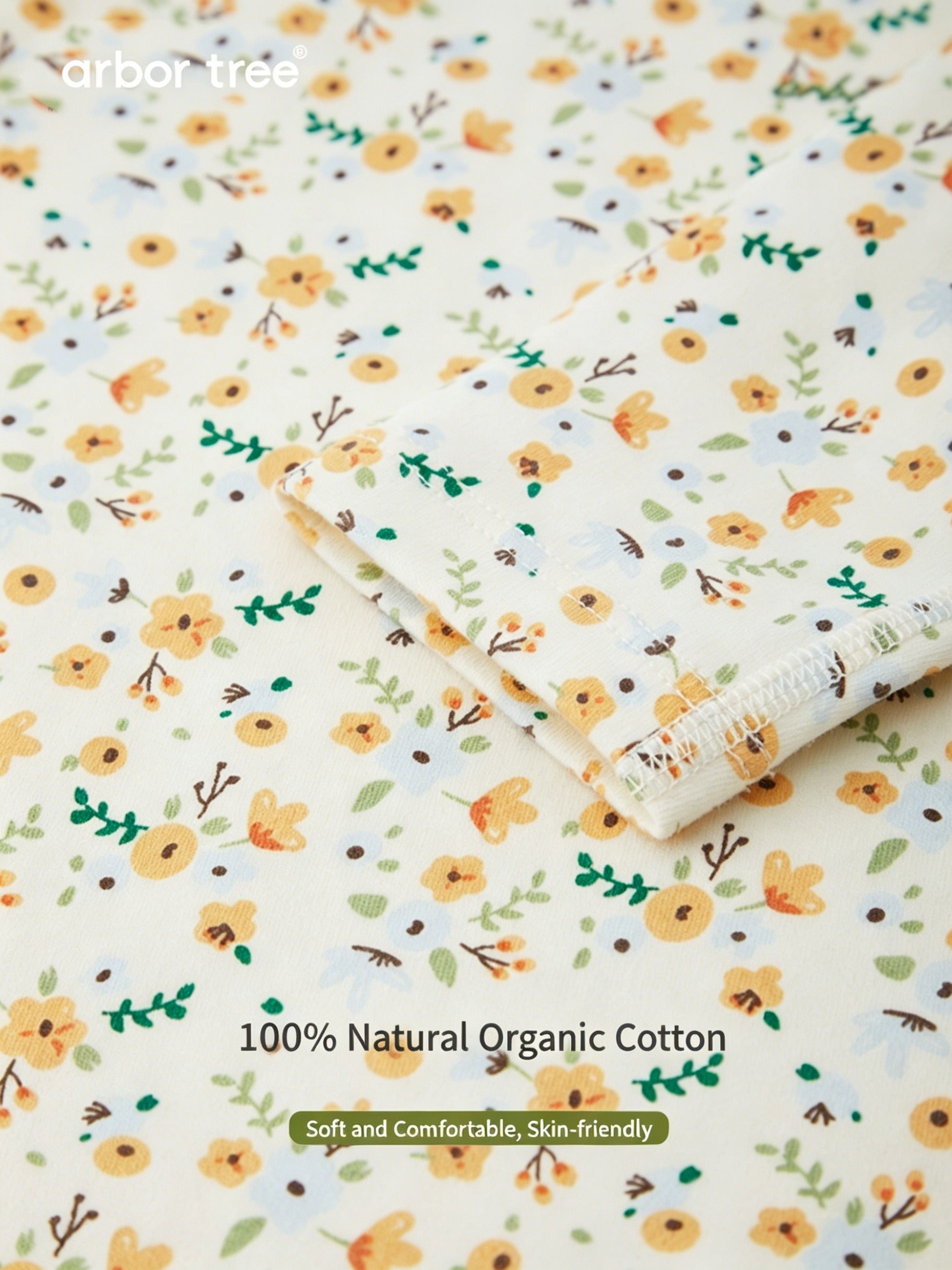 ArborTree organic cotton baby romper with small floral print, long sleeves, soft and gentle on baby's skin.