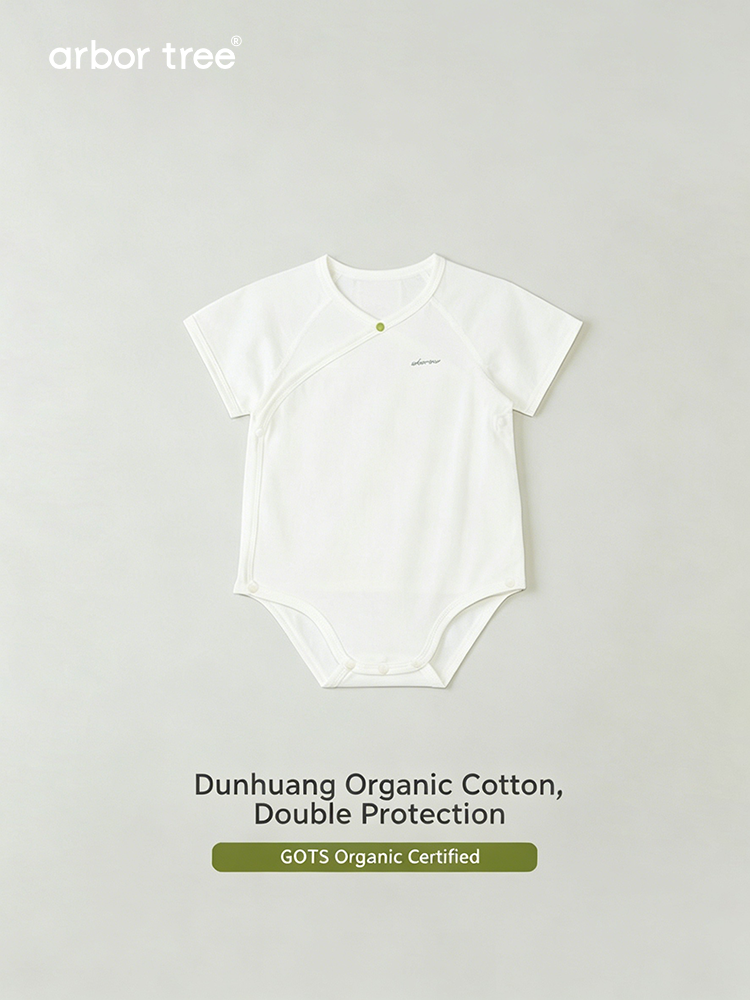 ArborTree organic cotton baby triangle crawling suit in soft natural color, designed for comfortable early mobility and play.