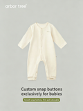 ArborTree organic cotton front-opening baby bodysuit, soft white fabric with snap closures and shoulder buttons for easy dressing.
