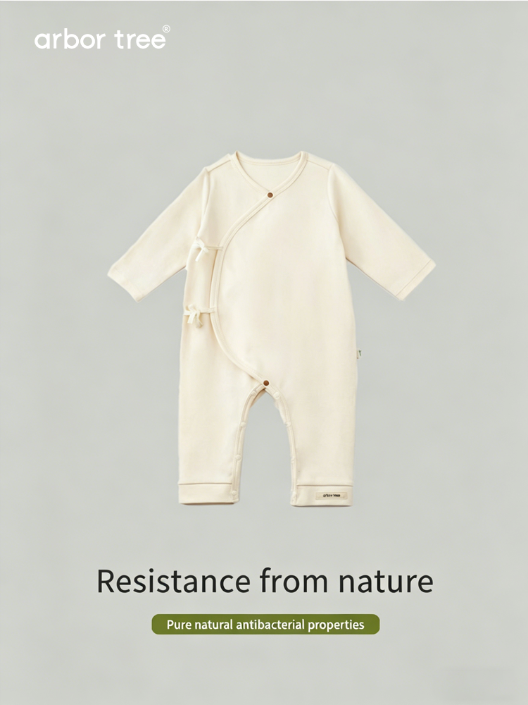Organic cotton baby tie-up harness by ArborTree, soft natural fabric and adjustable straps for comfortable infant support.