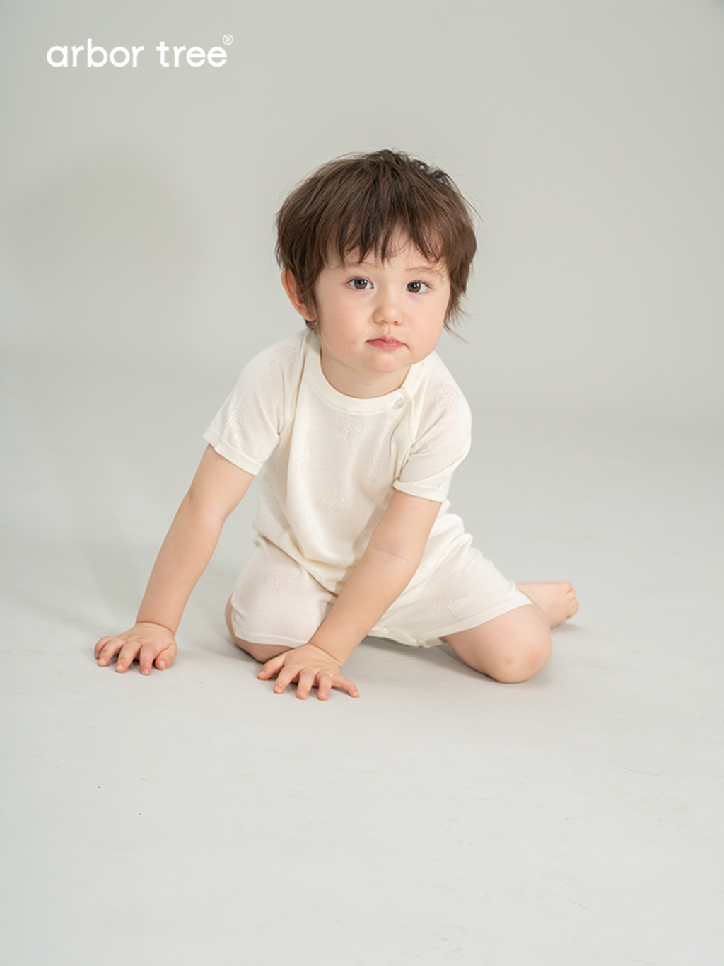 ArborTree Girls' and Boys' Summer Knit Short-Sleeve Romper with button detailing at the shoulders, crafted from a blend of mulberry silk and cashmere—cool, breathable, and lightweight