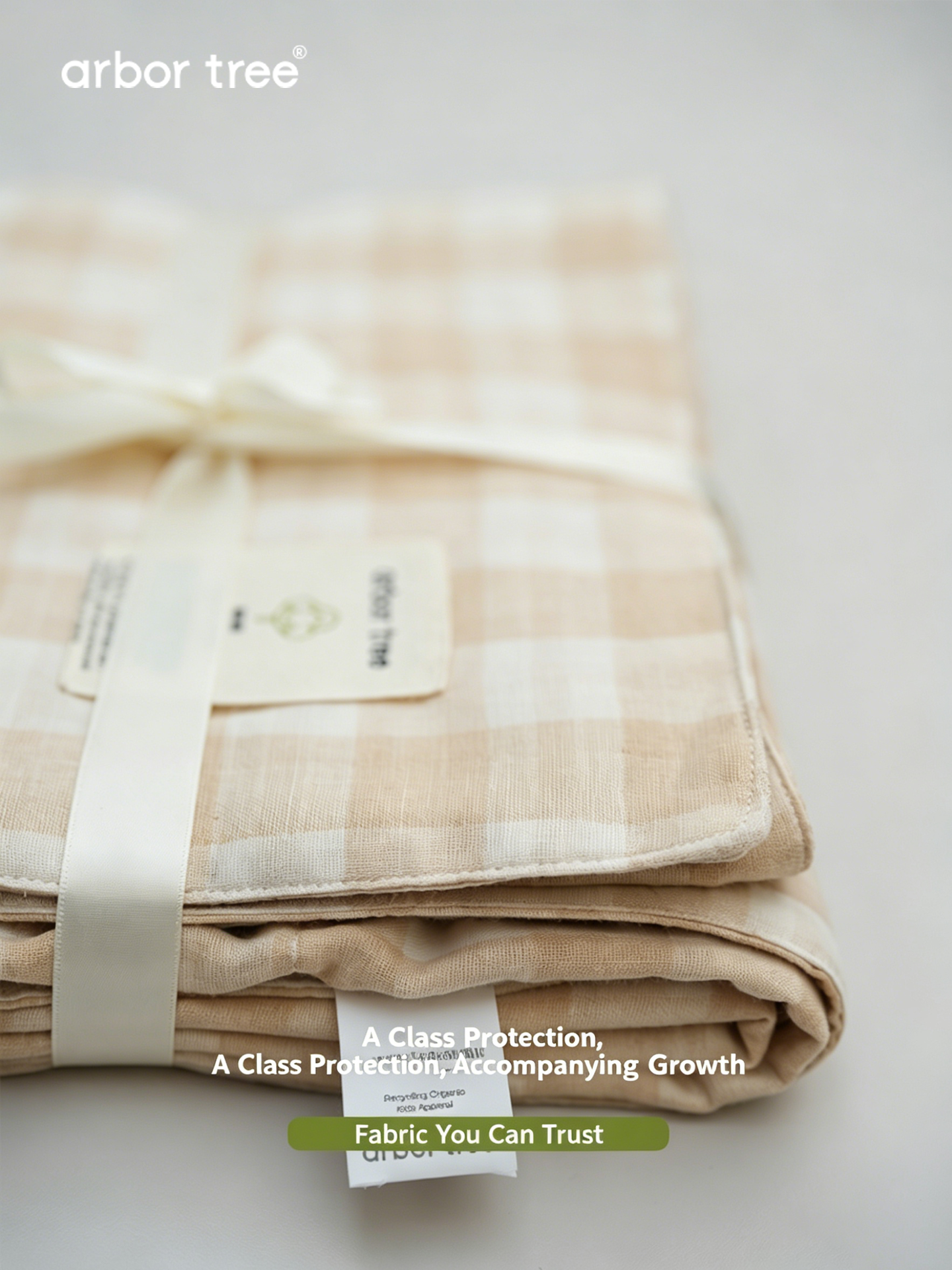 ArborTree organic cotton checkered baby blanket, small quilt perfect for swaddling or infant comfort, natural and soft texture.