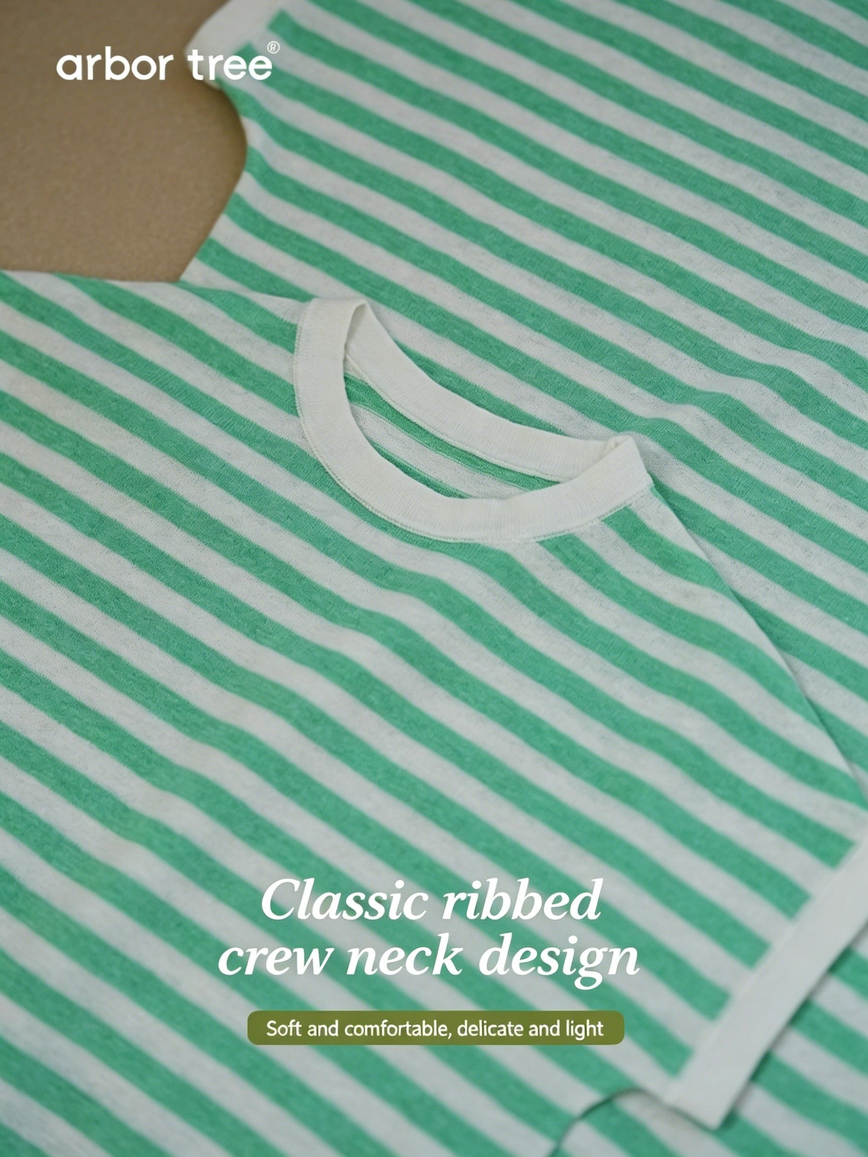 Child and parent wearing lightweight, striped knit tees made from 60% organic cotton and 40% linen by ArborTree.