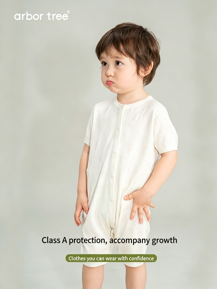 Soft silk and cashmere summer baby romper by arbortree with front-opening design, featuring a gentle pastel color and comfortable fit.