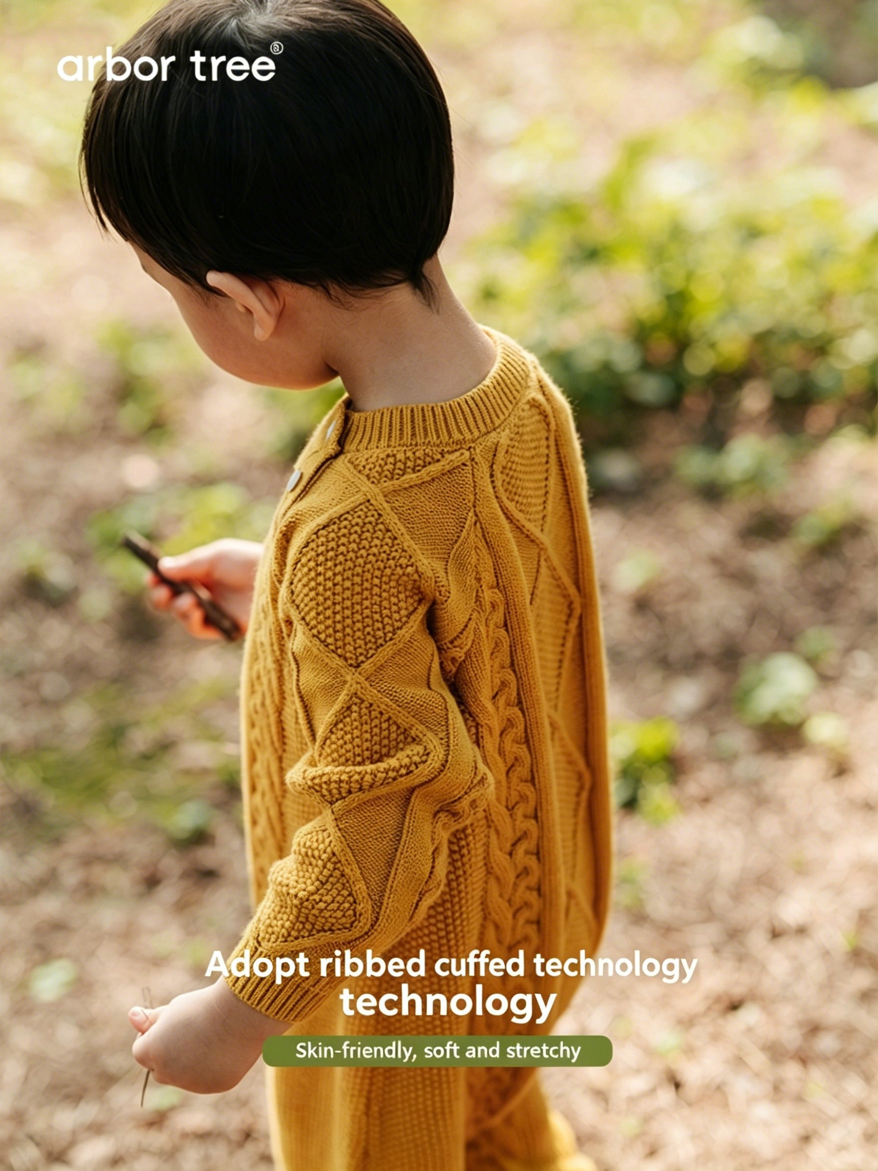 ArborTree organic cotton and cashmere kids' shoulder open jumpsuit in soft fabric, shown on a child.