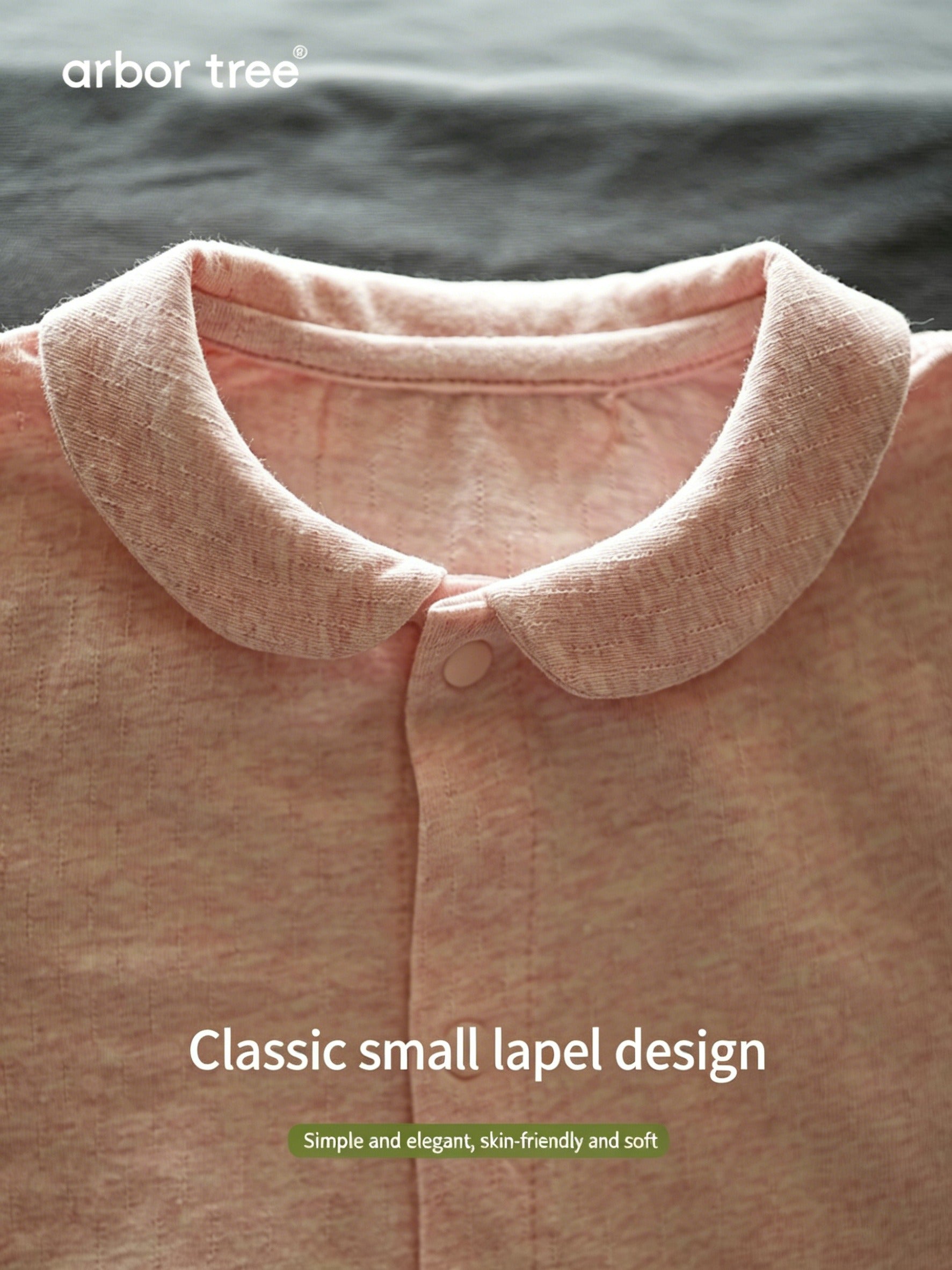 ArborTree organic cotton baby romper with collar, front opening, and moisture-wicking fabric, suitable for unisex spring wear.