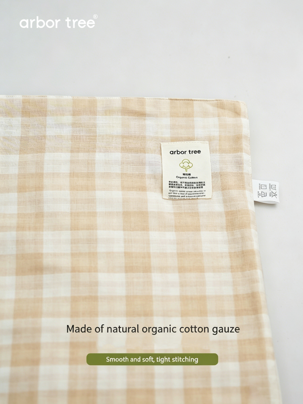 ArborTree organic cotton checkered baby blanket, small quilt and swaddle, soft infant blanket with a natural checkered pattern.
