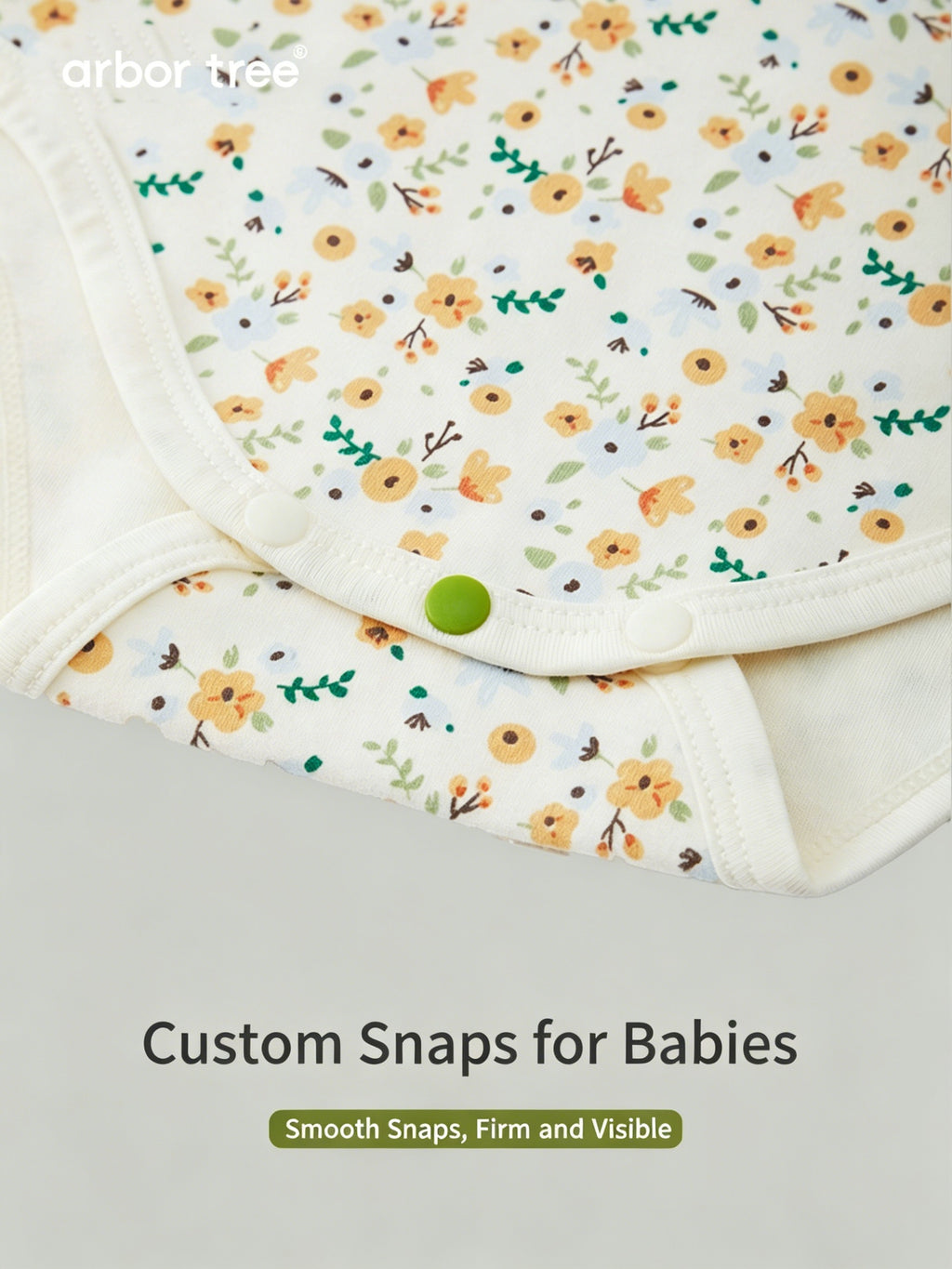 ArborTree organic cotton baby romper with small floral print, long sleeves, soft and gentle on baby's skin.