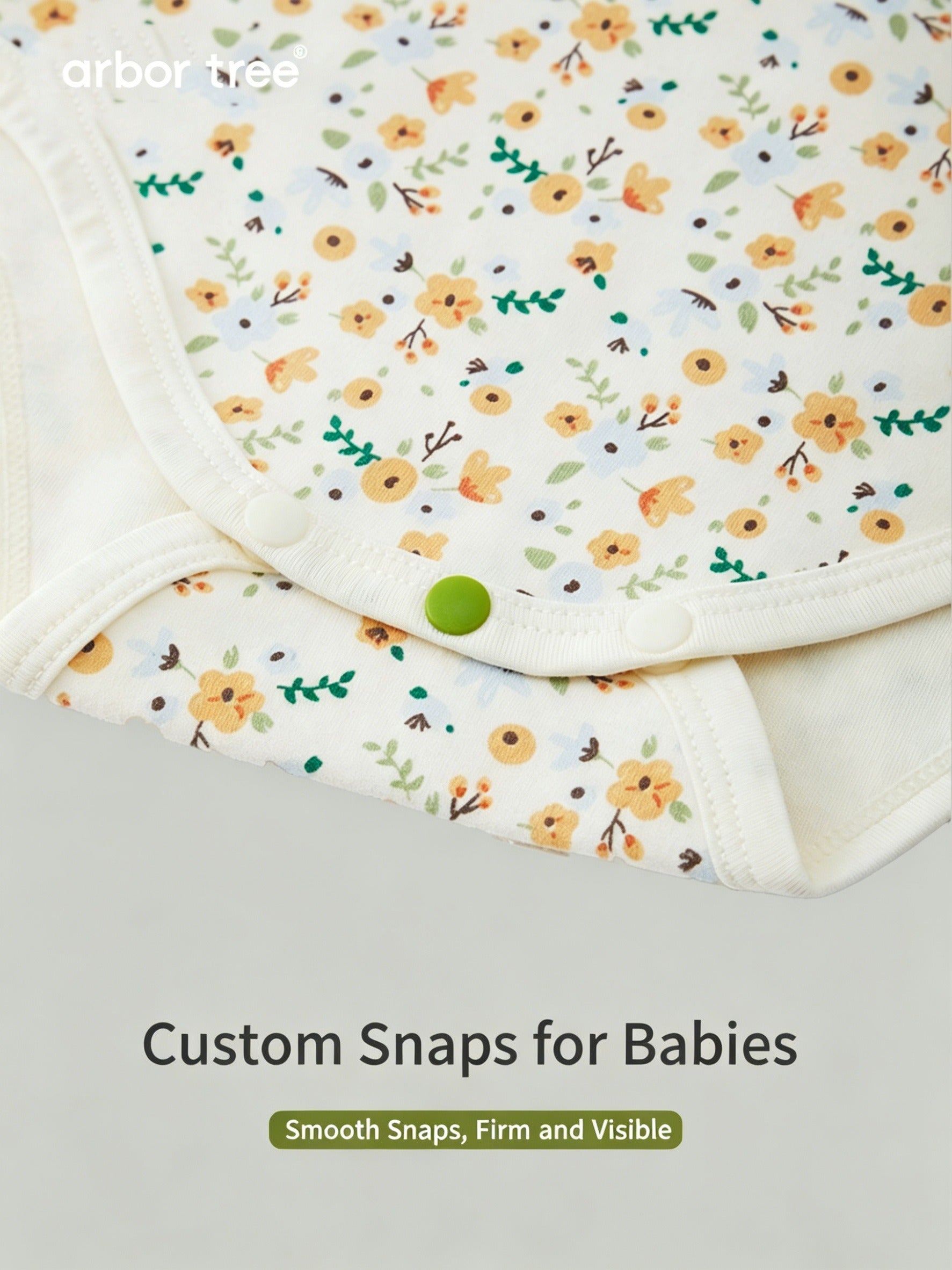ArborTree organic cotton baby romper with small floral print, long sleeves, soft and gentle on baby's skin.