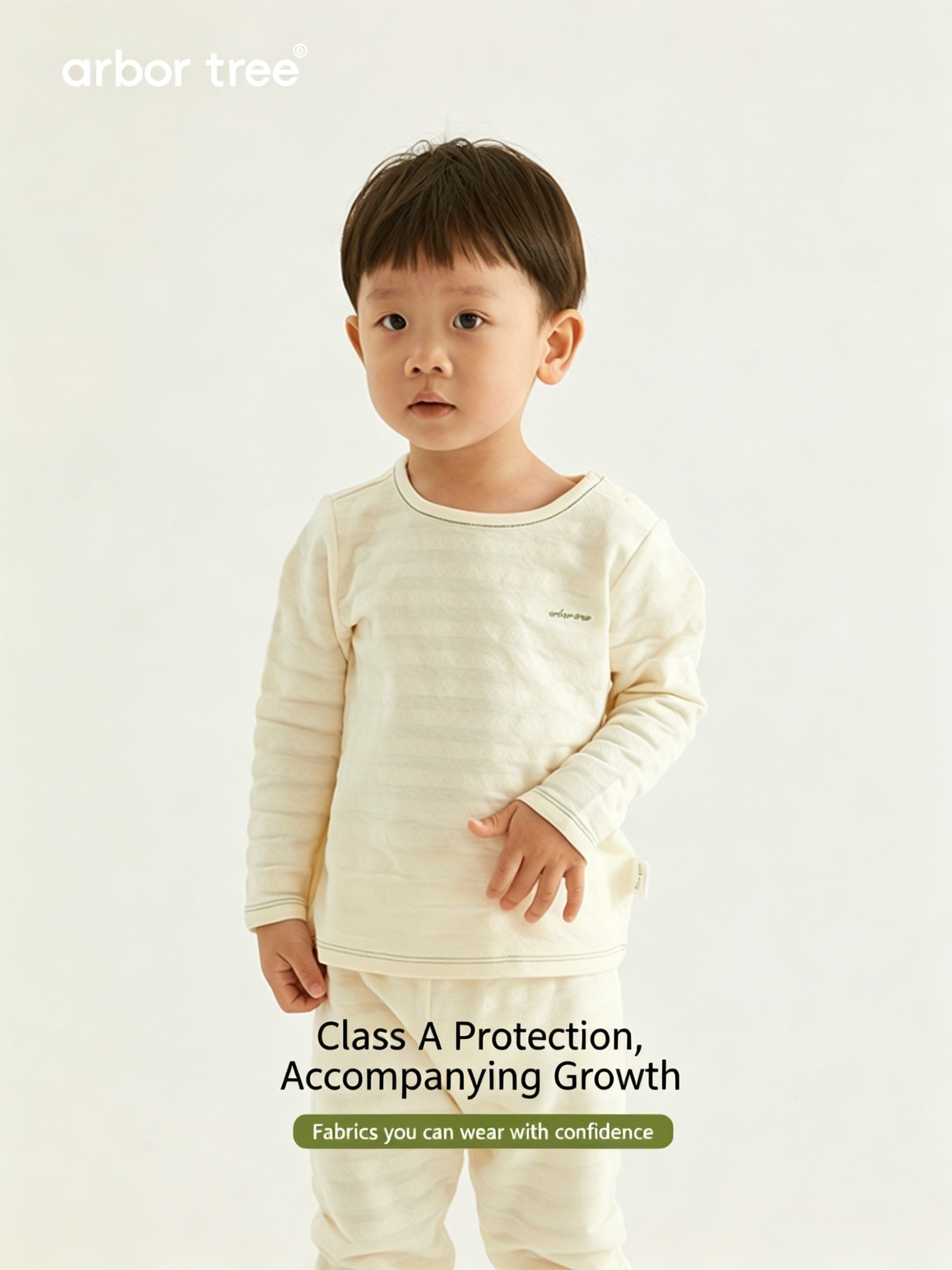 ArborTree organic cotton baby long-sleeve loungewear set in soft natural colors, perfect for spring, fall, and winter.