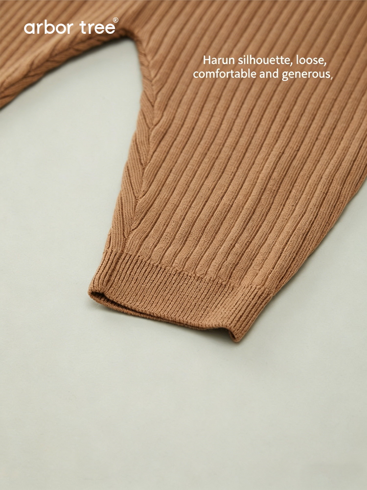 ArborTree 100% super fine wool baby bib pants in soft, natural wool with adjustable straps and a cozy, stylish design for infants.