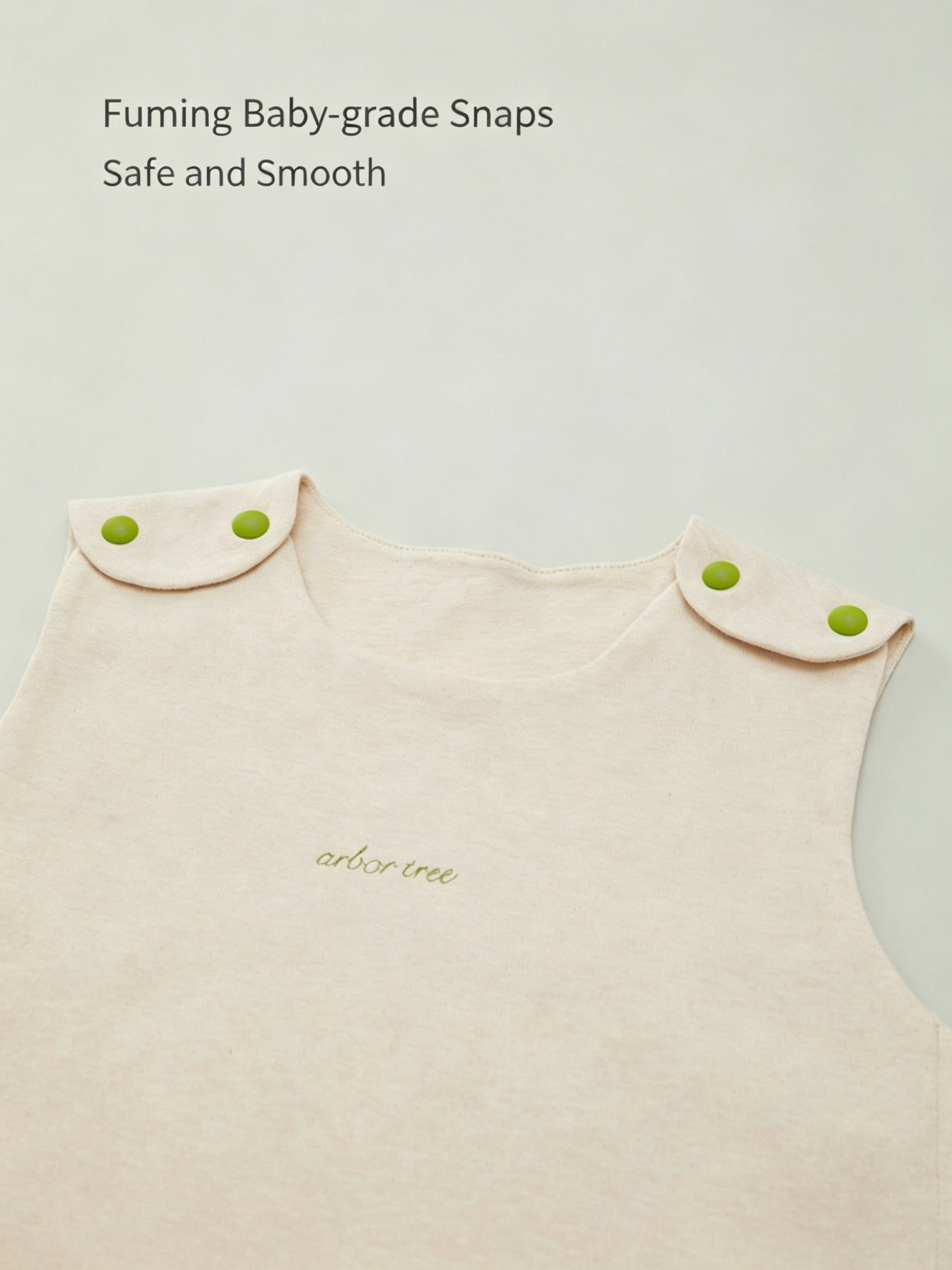 ArborTree organic cotton baby sleeveless sleeping bag lying flat, soft natural fabric designed for comfortable sleep for infants.