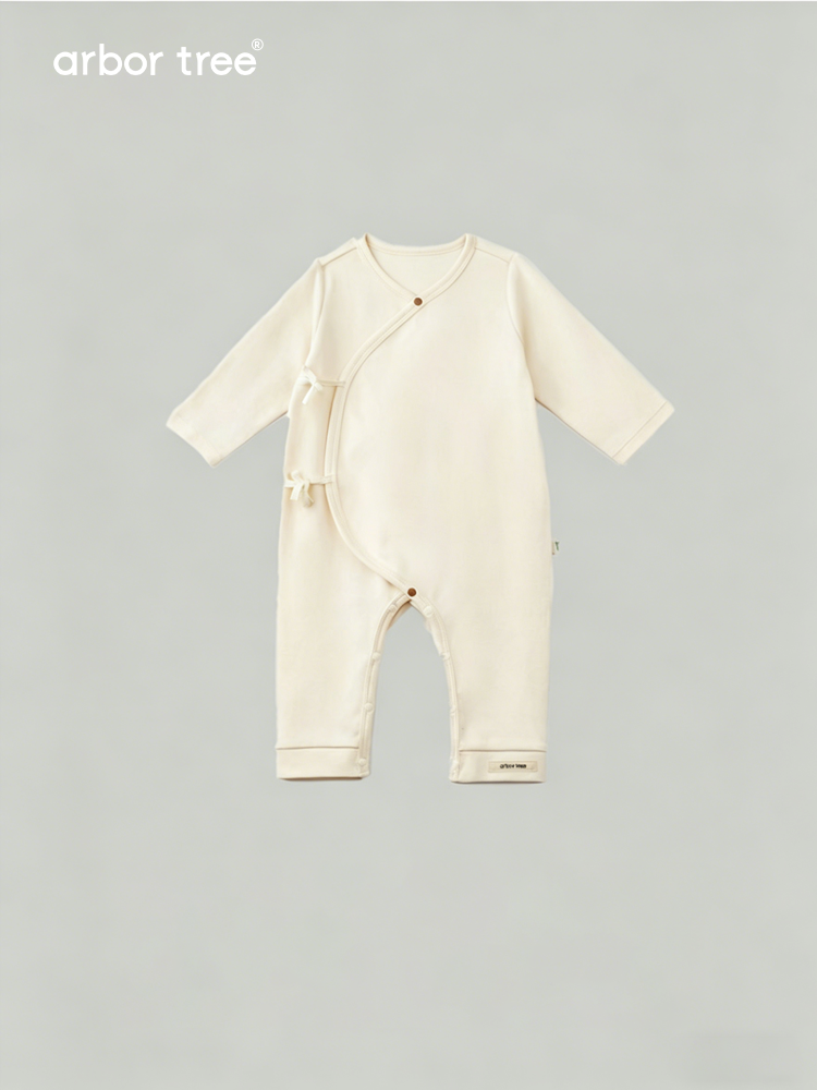Organic cotton baby tie-up harness by ArborTree, soft natural fabric with adjustable straps for comfortable baby safety and support.