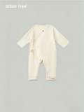 Organic cotton baby tie-up harness by ArborTree, soft natural fabric with adjustable straps for comfortable baby safety and support.
