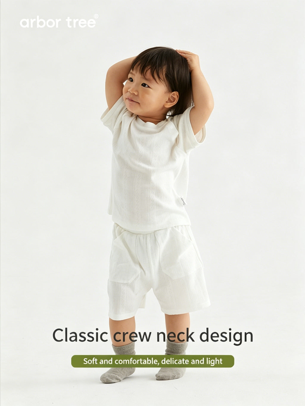 Organic cotton baby summer suit by ArborTree, lightweight and breathable, featuring a soft, natural fabric for comfortable warm-weather wear.
