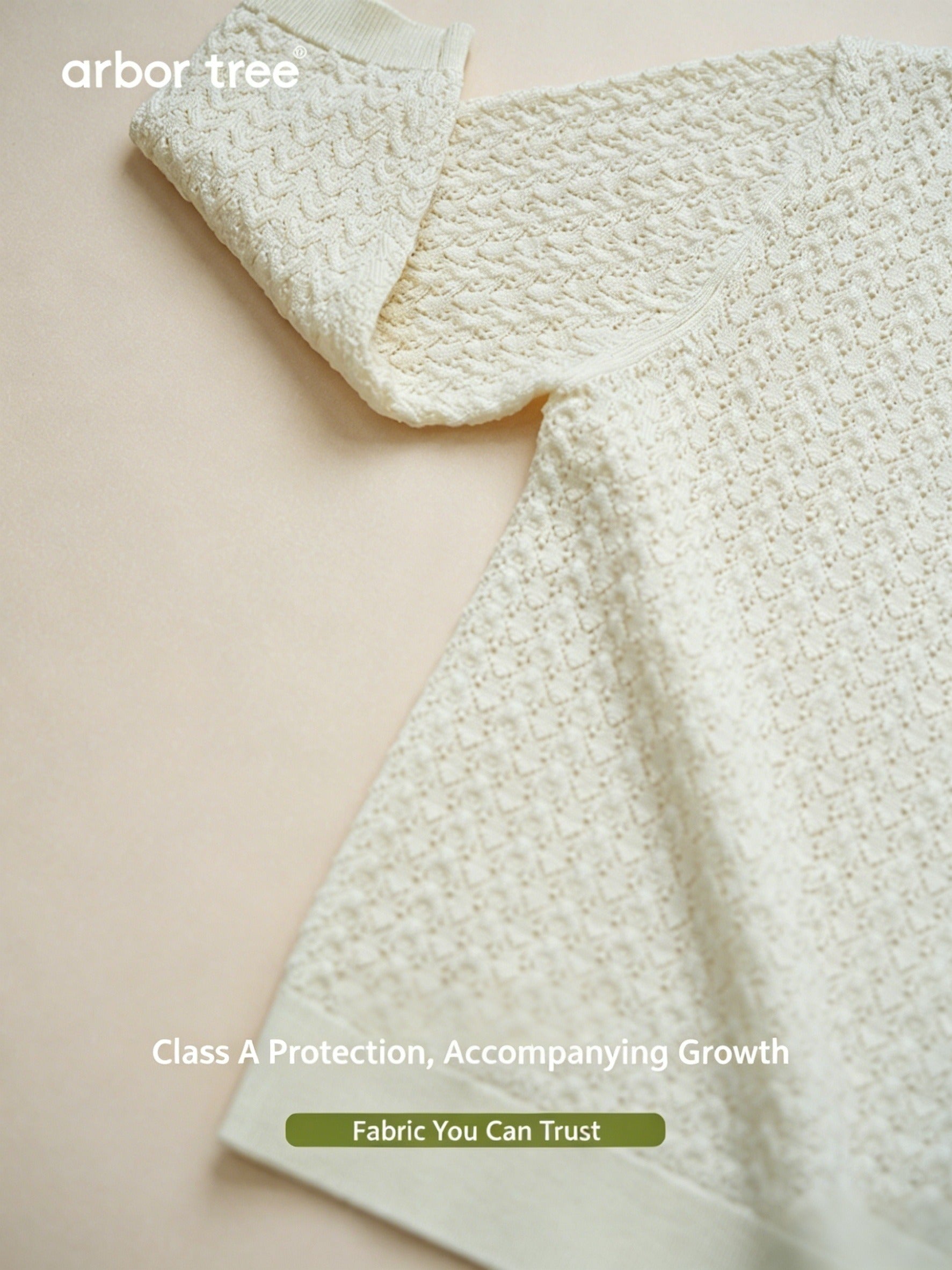 Matching ArborTree merino wool long-sleeve tops for parent and child with whisper-pattern knit in spring and fall.