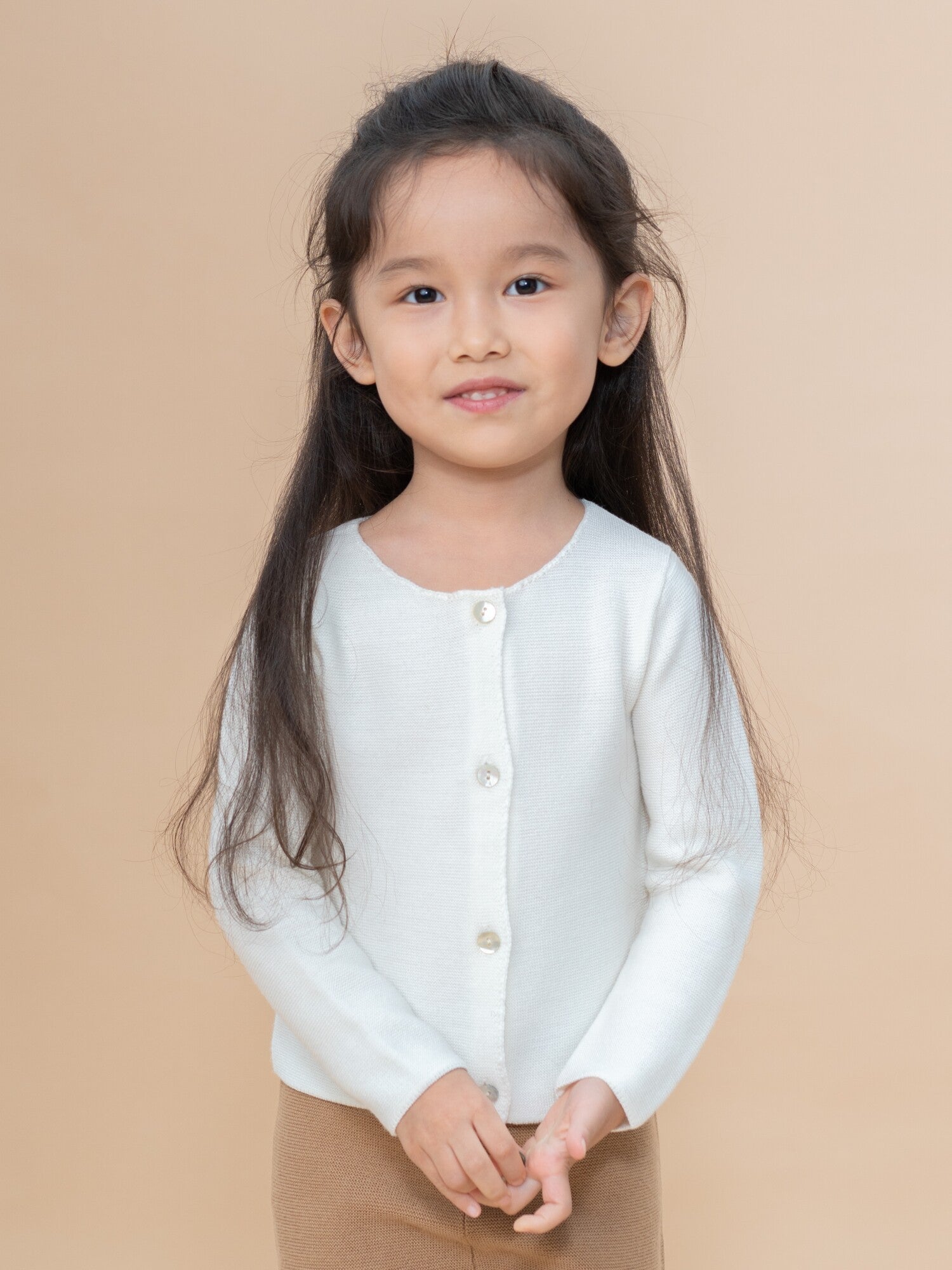 ArborTree 100% Merino Wool baby cardigan coat in soft cream, featuring button closure and cozy knit design for infants.