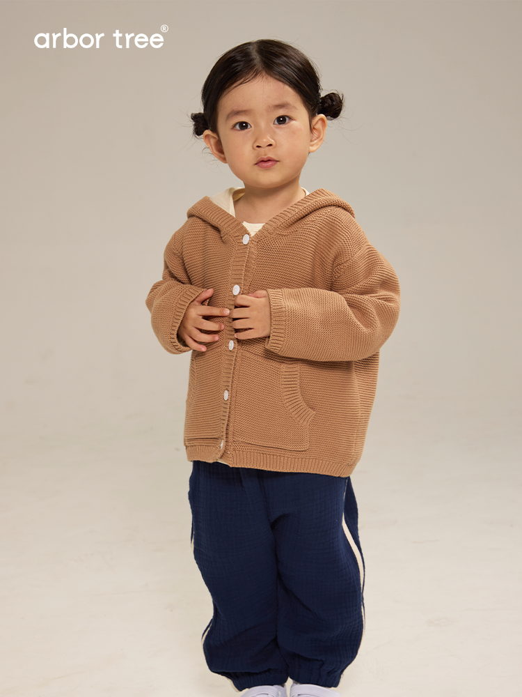 Unisex ArborTree organic cotton hooded kids' jacket with warm lining, suitable for spring, fall, and winter outdoor wear.