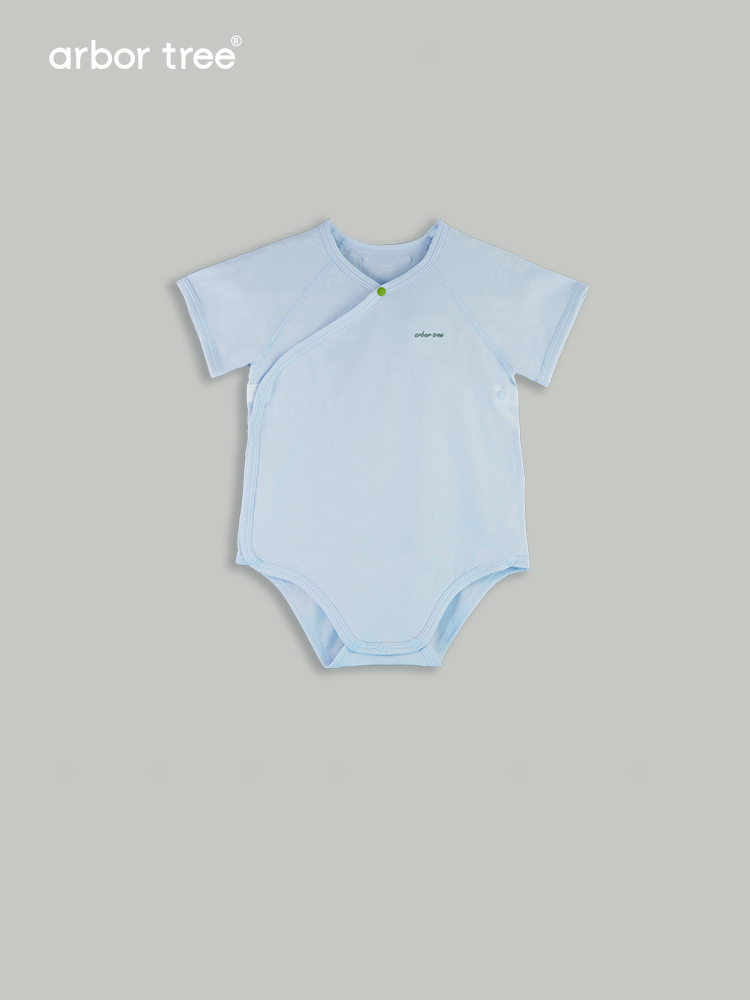 ArborTree organic cotton baby crawling suit with triangle design, soft natural fabric, suitable for infants' comfort and movement.