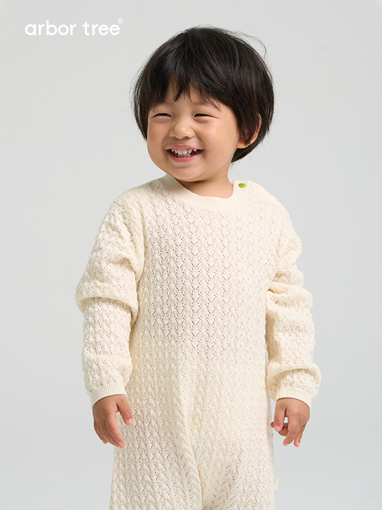 ArborTree merino wool baby romper with whisper pattern, shoulder split, ideal for spring and fall, soft and cozy for infants.