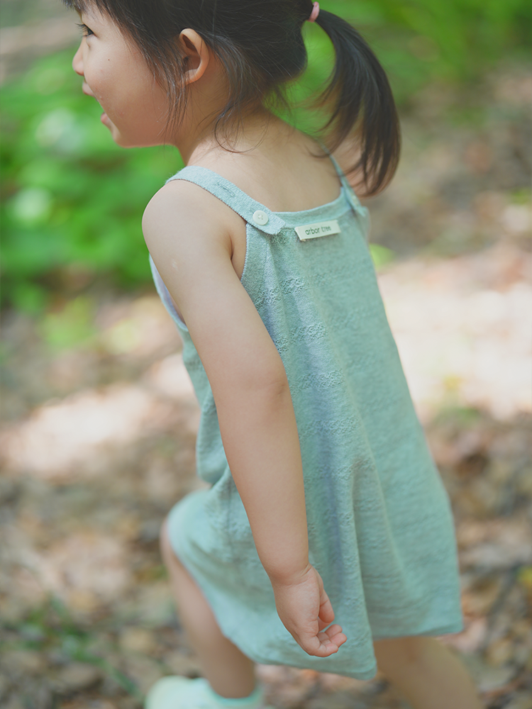 Lightweight summer baby girl tank dress by ArborTree made from 60% organic cotton and 40% linen, featuring a soft, breathable fabric.