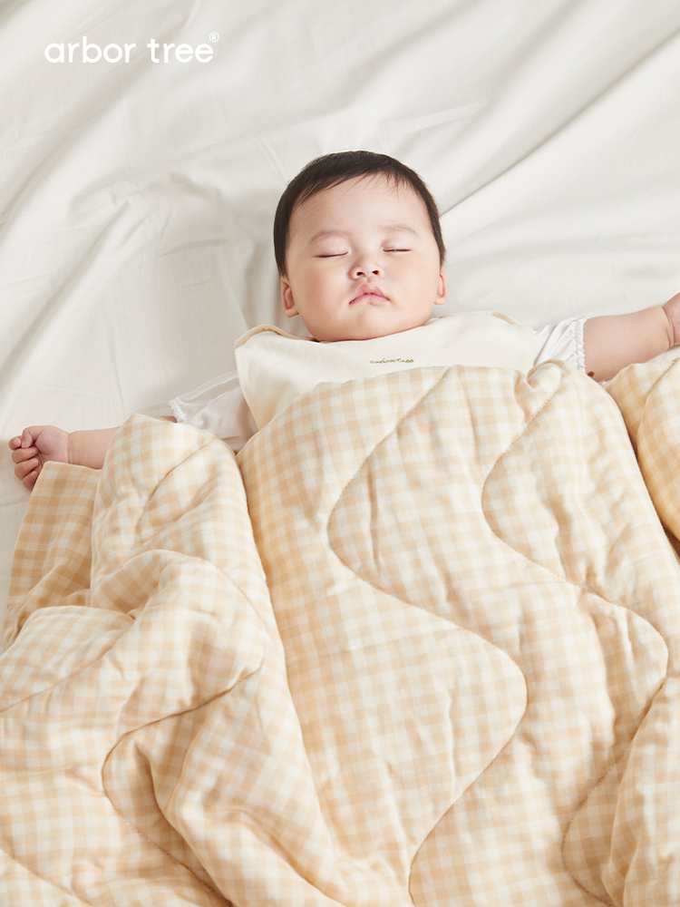 Soft organic cotton baby quilt by ArborTree, breathable, moisture-wicking, and machine washable for cozy comfort.