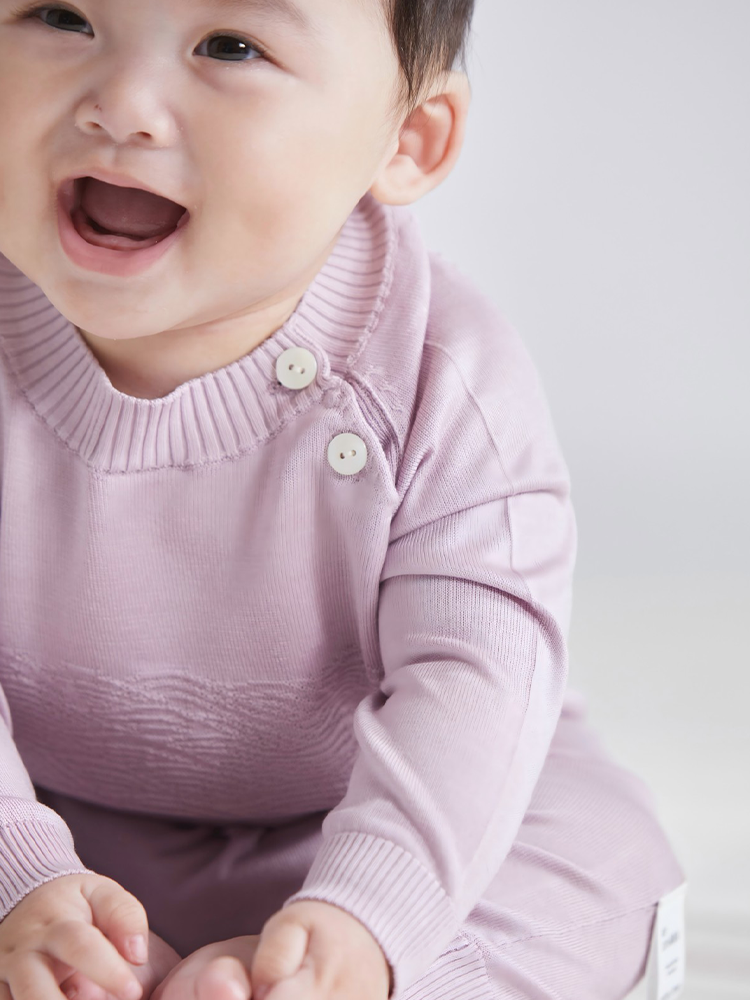 Unisex ArborTree mulberry silk baby romper with wavy knit pattern, long sleeves, soft spring/fall clothing for infants.