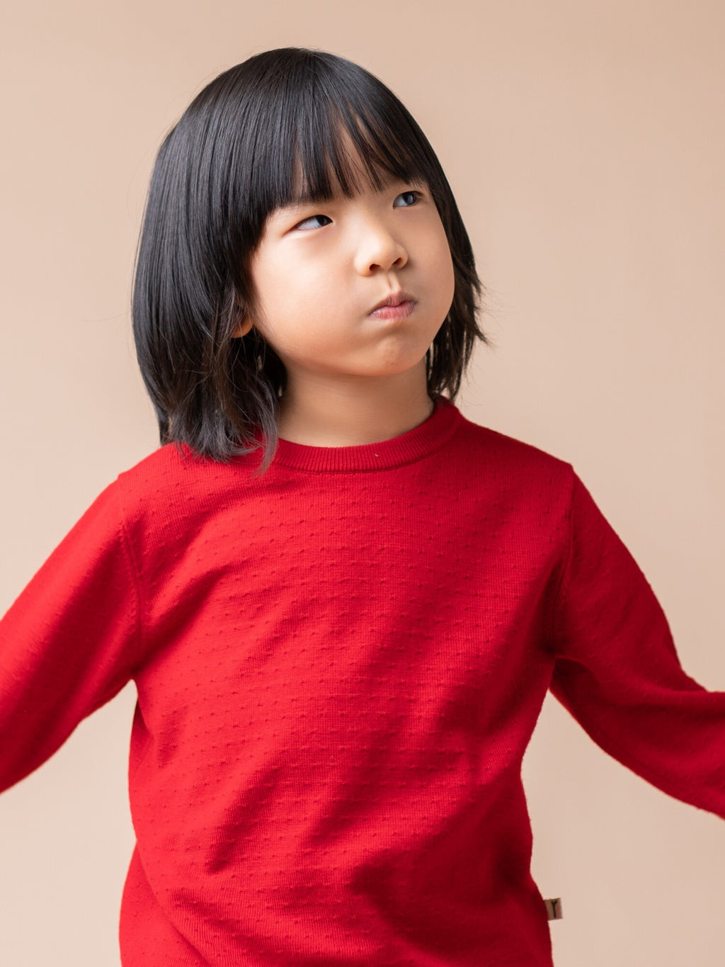 Children wearing ArborTree Merino Wool fall and winter sweaters, showcasing cozy, warm wool knit in natural colors.