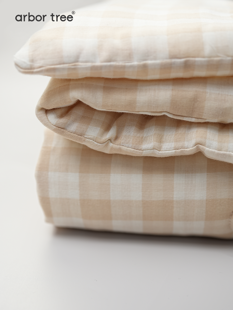 Organic cotton baby quilt by ArborTree with warm, breathable, moisture-wicking fabric, perfect for cozy, machine washable comfort.