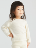 Baby cashmere raglan top by ArborTree, soft and cozy, featuring a classic raglan sleeve design in natural shades.