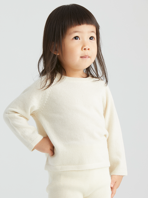 Baby cashmere raglan top by ArborTree, soft and cozy, featuring a classic raglan sleeve design in natural shades.