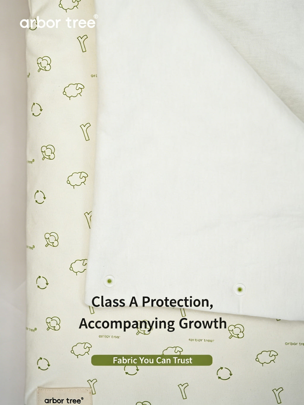 Organic cotton baby swaddle blanket from ArborTree, soft natural material, shown wrapped around a baby on a neutral background.
