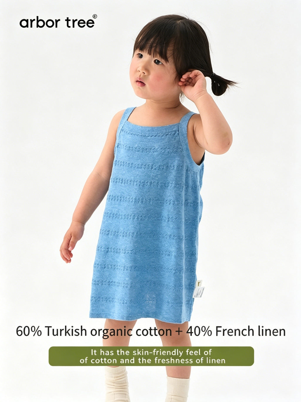 Baby girl summer tank dress by ArborTree made of lightweight organic cotton and linen, featuring a soft, breathable fabric.