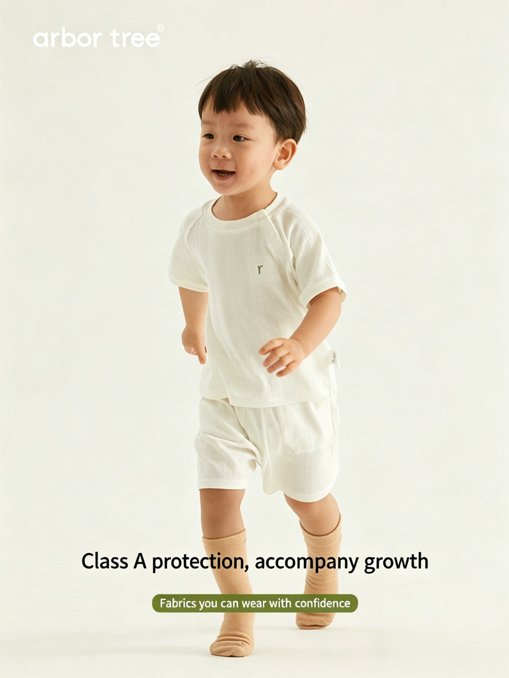 Organic cotton baby summer suit by ArborTree, natural and breathable baby clothing with cute design, perfect for warm weather.