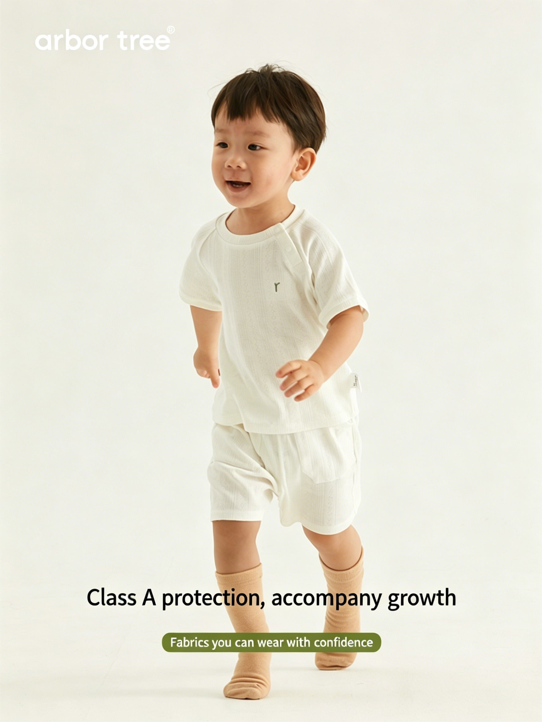 Organic cotton baby summer suit by ArborTree, natural and breathable baby clothing with cute design, perfect for warm weather.